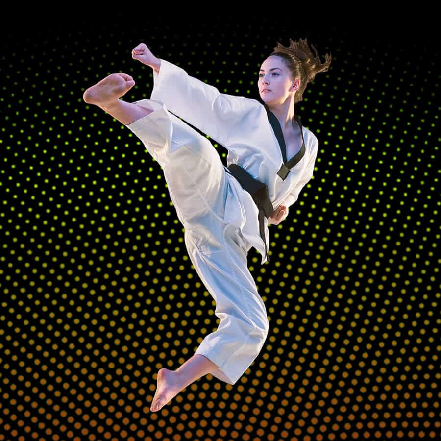 Martial Arts Lessons for Adults in Virginia Beach VA - Girl Black Belt Jumping High Kick